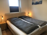 Ferienhaus in Fehmarn OT Gammendorf - Feriendomizil SeeSand 2 - Schlafzimmer mit Doppelbett Ferienhaus in Fehmarn OT Gammendorf - Feriendomizil SeeSand 2 - Schlafzimmer mit Doppelbett