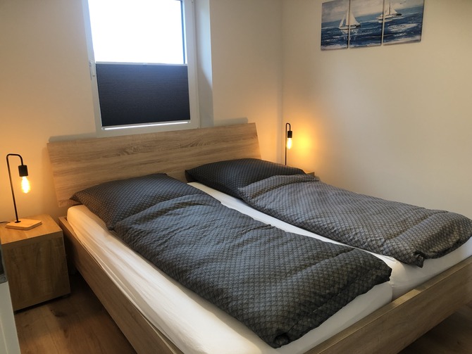 Ferienhaus in Fehmarn OT Gammendorf - Feriendomizil SeeSand 2 - Schlafzimmer mit Doppelbett Ferienhaus in Fehmarn OT Gammendorf - Feriendomizil SeeSand 2 - Schlafzimmer mit Doppelbett